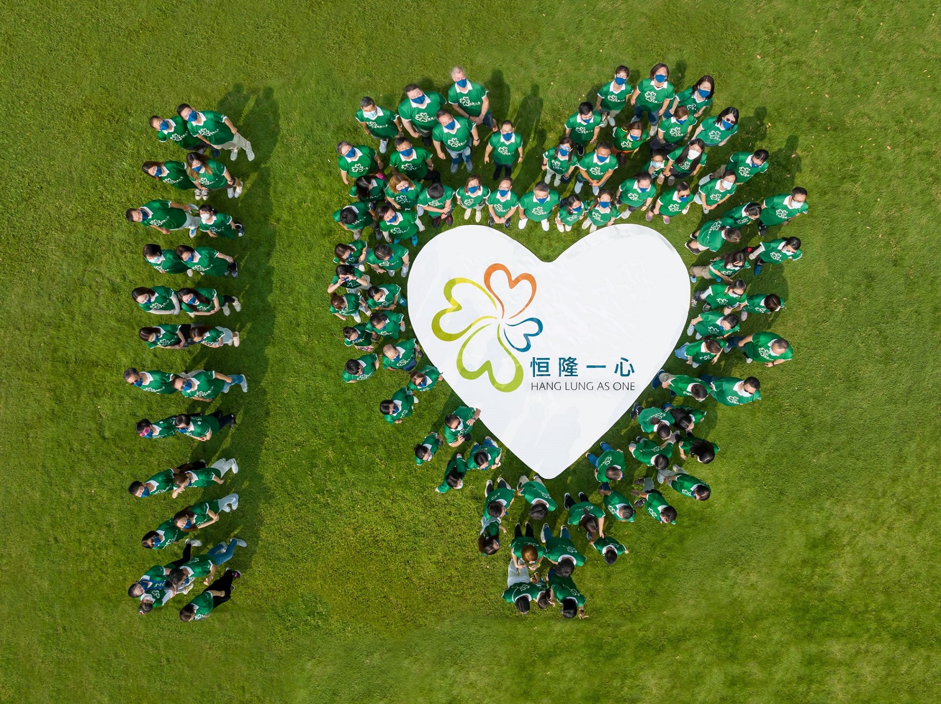 100 volunteers write 'one heart' in the form of a 